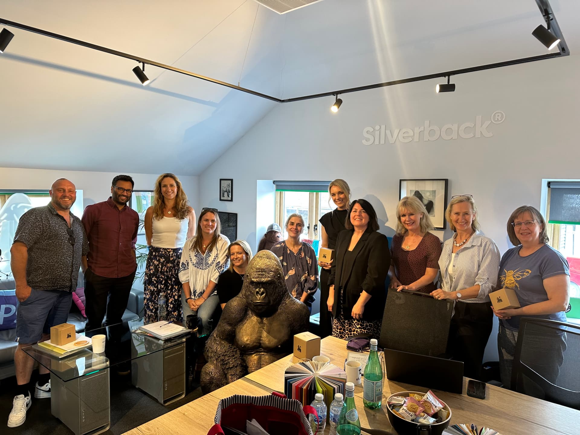 Members gathered together during a host visit to a member studio