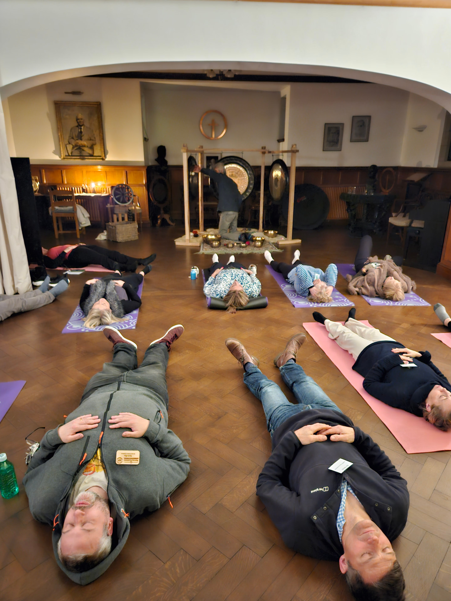 Members lying on mats during a sound bath at a wellbeing networking event