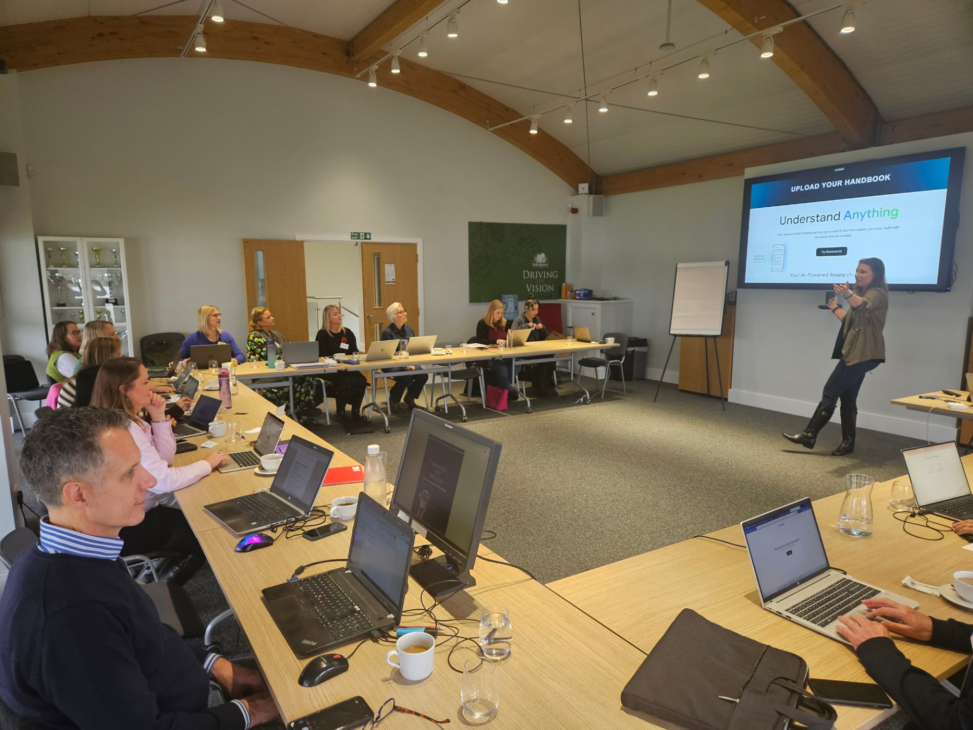 Vicky Hall Hunter delivering a hands-on AI training session to members