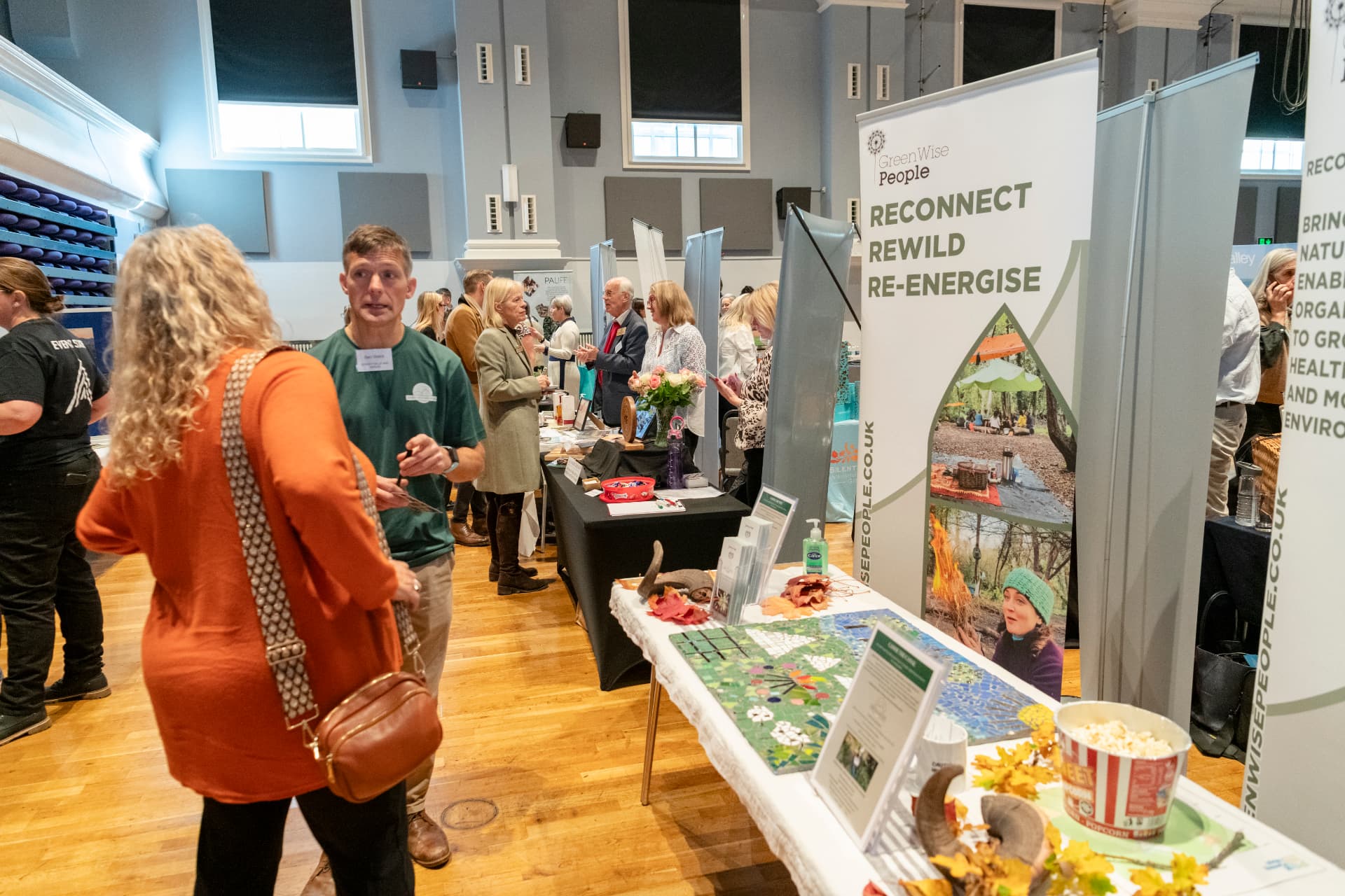 Member organisations meeting at exhibition stands during a showcase