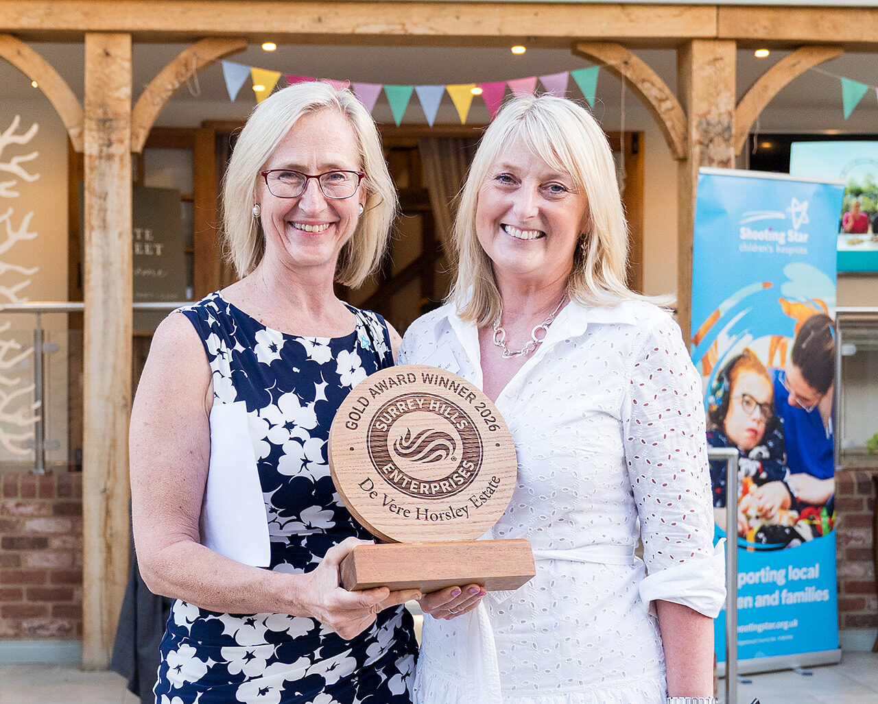 Members celebrating at the Surrey Hills Enterprises summer party at Gate Street Barn